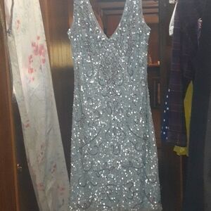 Beautiful light blue sequined dress, slightly above the knee